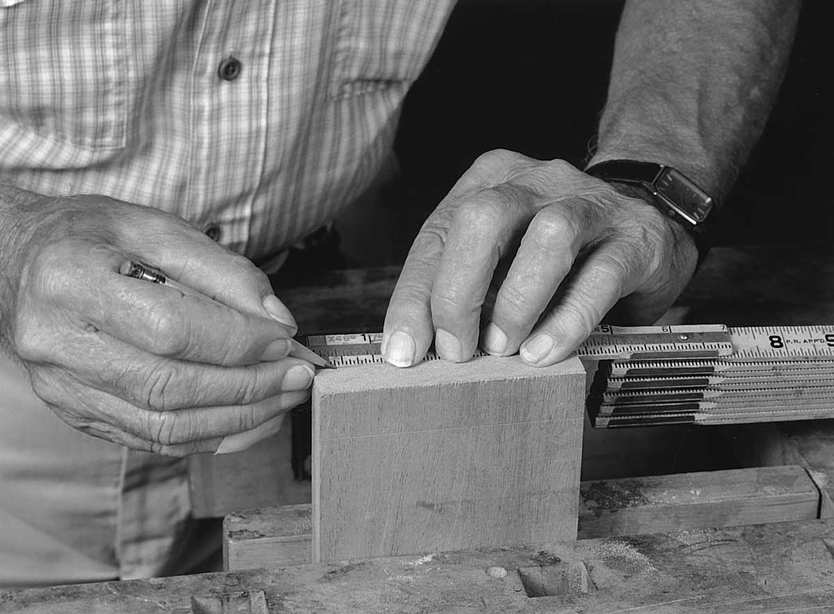 Gauge the baseline on both sides of the boards being dovetailed together.