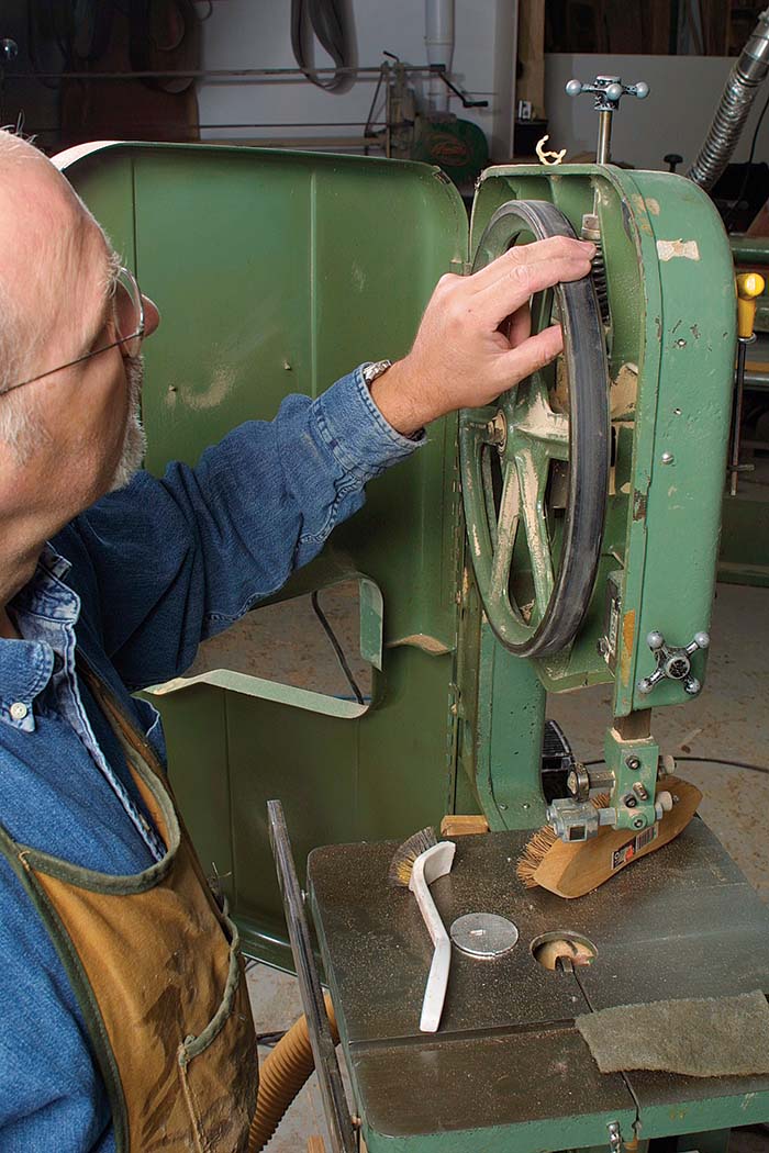 The first step in overhauling a bandsaw is to check the tires for grooves 