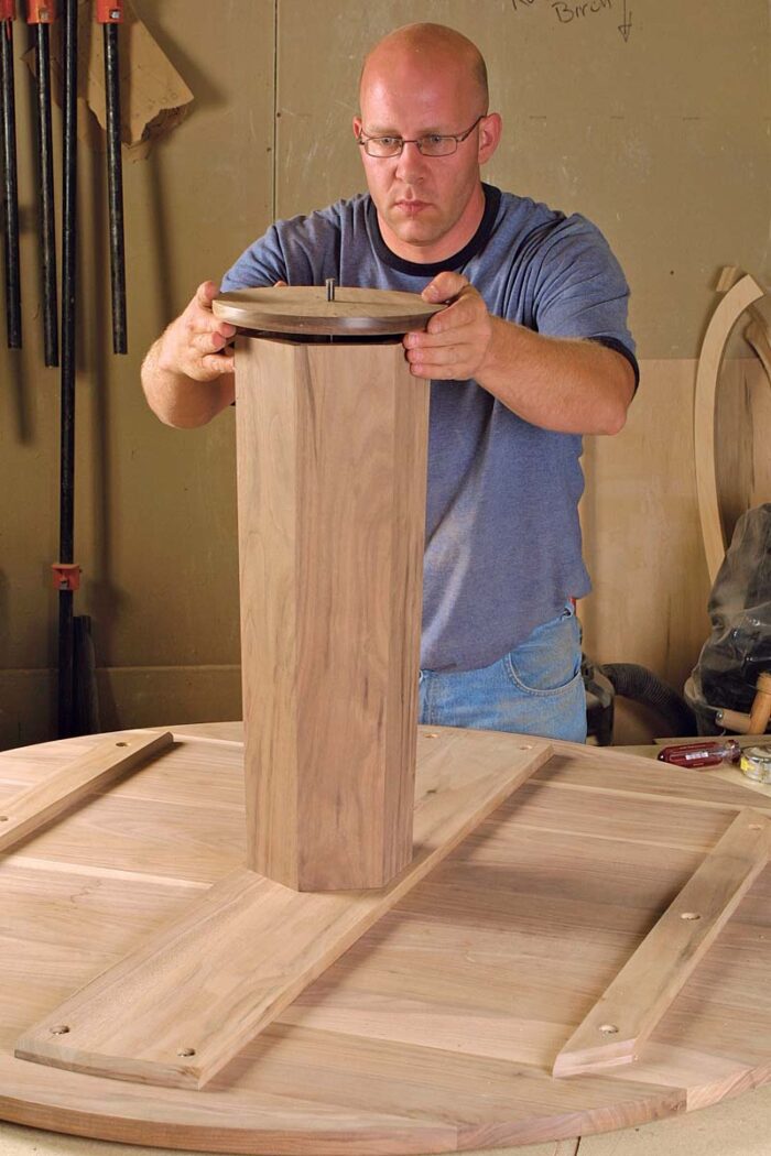 Assemble the table. A threaded steel rod feeds through each section of the table. Secure the nut at the top with Thread Lock, then tighten the nut at the bottom.