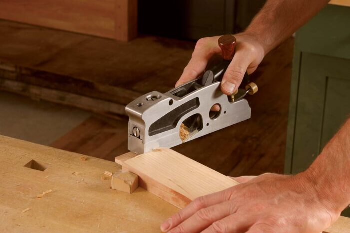 few light passes with the shoulder plane on each tenon cheek will transform a tight-fitting joint into one that fits perfectly