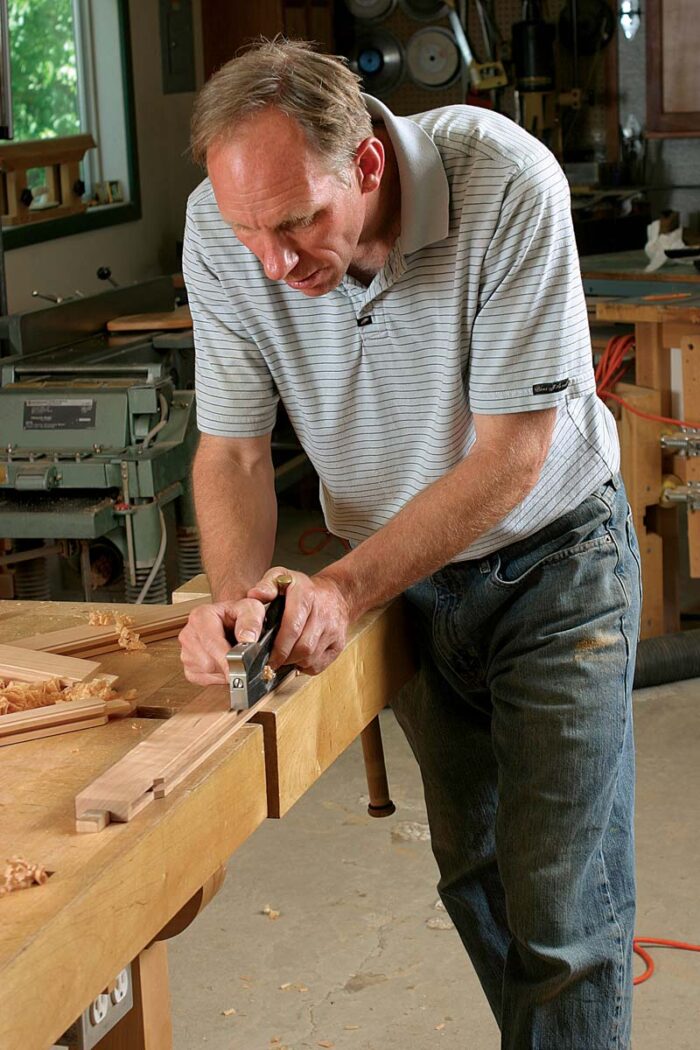 and the top and bottom moldings of a case have surfaces that will be exposed when the cabinet is assembled. The shoulder plane is perfect for cleaning up the machine marks left by the tablesaw or router.