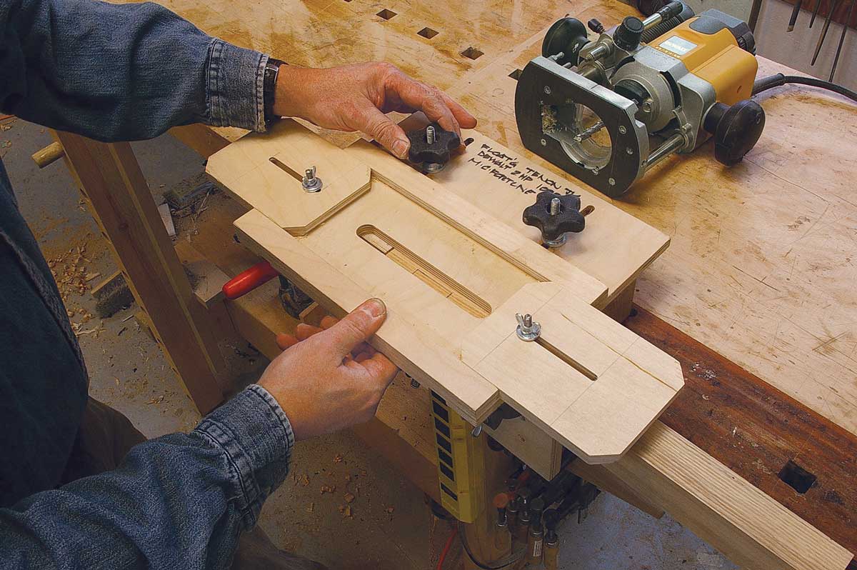 Adjust front to back and side to side. Slide the top so the view port is centered on the mortise (above). With the router bit just touching one end of the mortise (right), move the slide until it touches the router base and tighten the wing nut.