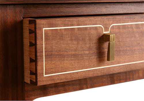 a close up a drawer on an Edward Barnsley-inspired table