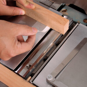 lower the outfeed table and use a block of wood to represent stone to sharpen jointer knives