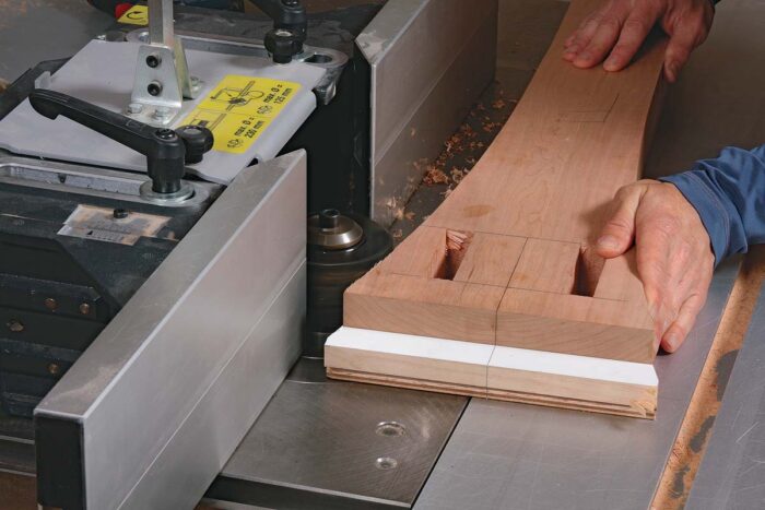 After roughing out the curves at the bandsaw, screw the post to a post template. Chaffin uses a shaper for the job, but a router table and a bearing-guided bit work, too.