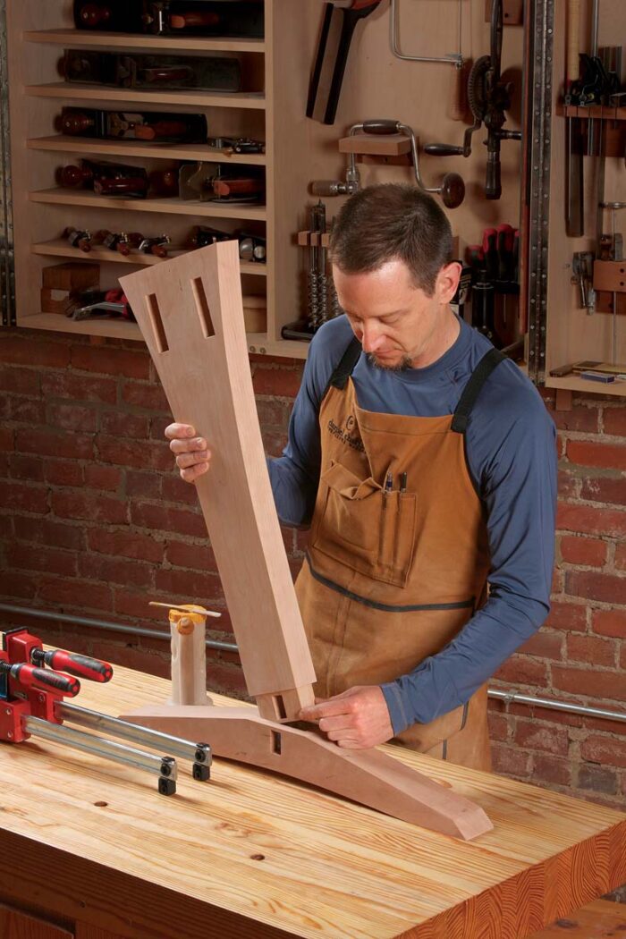 Brush it on all four walls of the mortise instead. After inserting the post, check the stretcher mortise for glue. Do both posts, and let them dry.