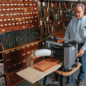 feeding the sled board to make cuts with planer