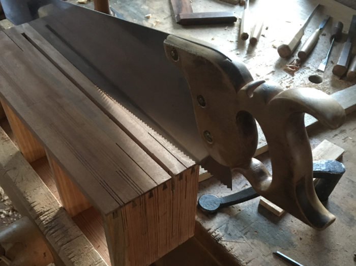 placing saw in saw box