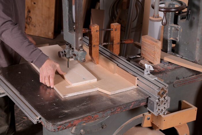 inserting a shim between the jig and the rip fence for the first cut