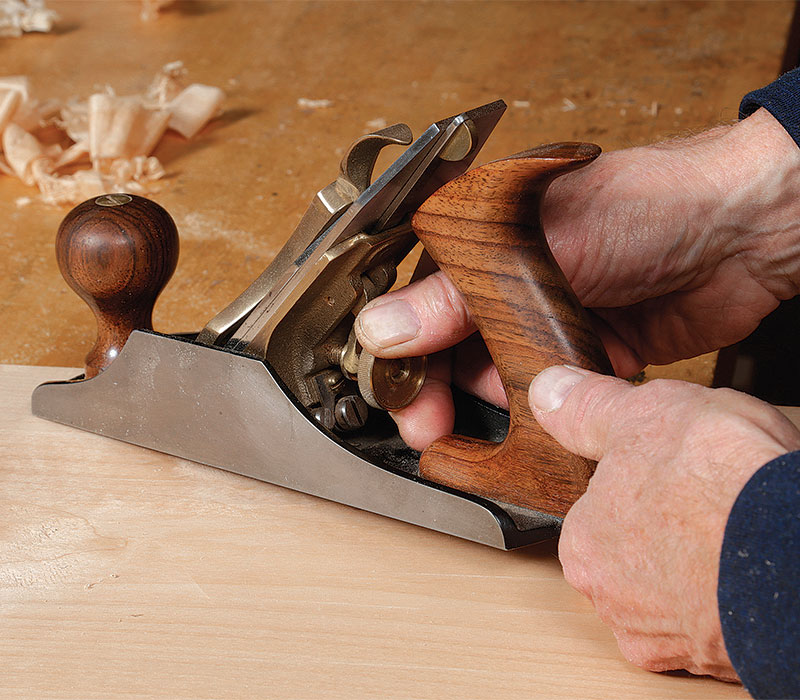 A heavy cut digs deeper into the wood, making shavings more likely to follow falling grain and lever out ahead of the blade.