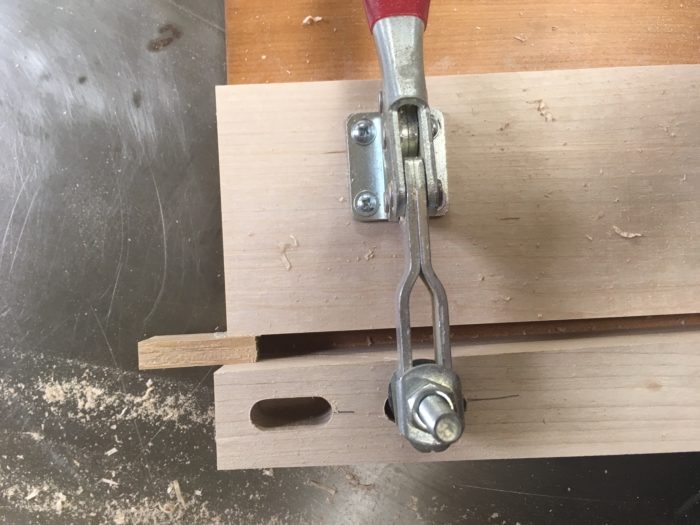 clamp holding the leg secure for sawing 