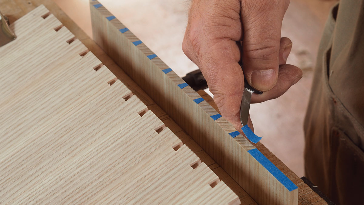 Peel and saw. After scribing though the tape, peel away the pieces from the waste areas, creating a clear road map for sawing.