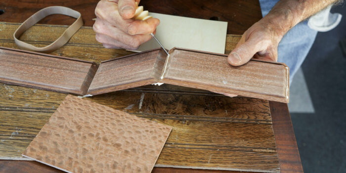 Gluing sides of a wood box before assembly