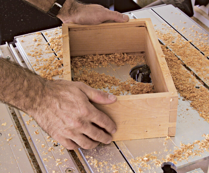 Rout the grooves on a router table.