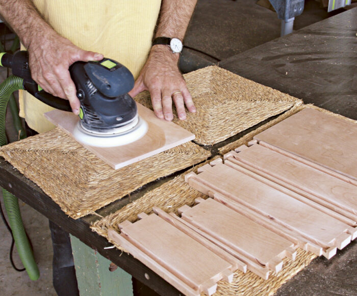 Sand boards with 220 grit sand paper before assembly.