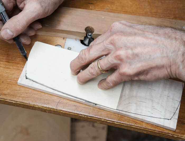 Creating a paper or wood template for designing the shape of the lid