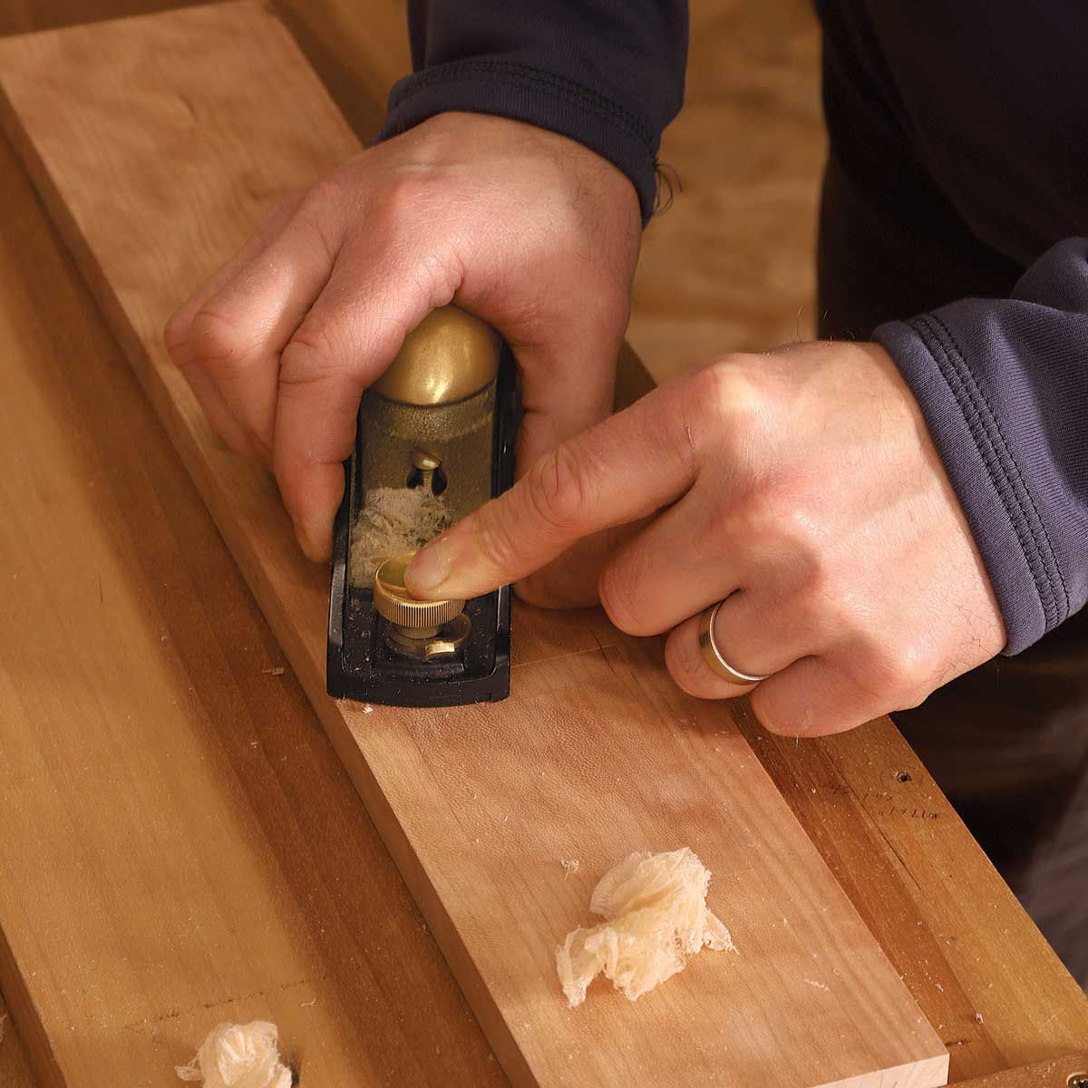 A little smoother. With a razor-sharp cambered blade set for a fine cut, a block plane can prepare a surface for finishing every bit as well as a smoothing plane. Korsak uses a block plane for smaller surfaces and a smoothing plane for larger ones.