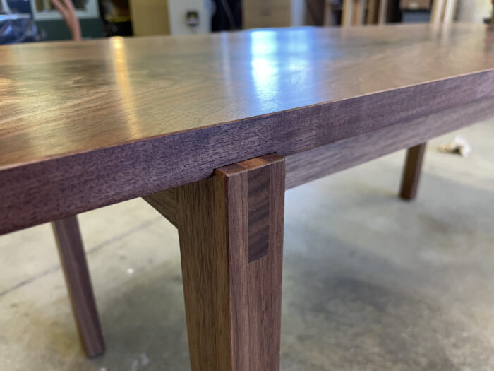 A bridle joint in the coffee table, set into a dado.