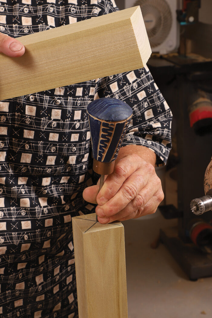 Nail the center point. After marking the center point, Ireland punches it with an awl (her awl’s shopmade handle reveals her sculptural flair).