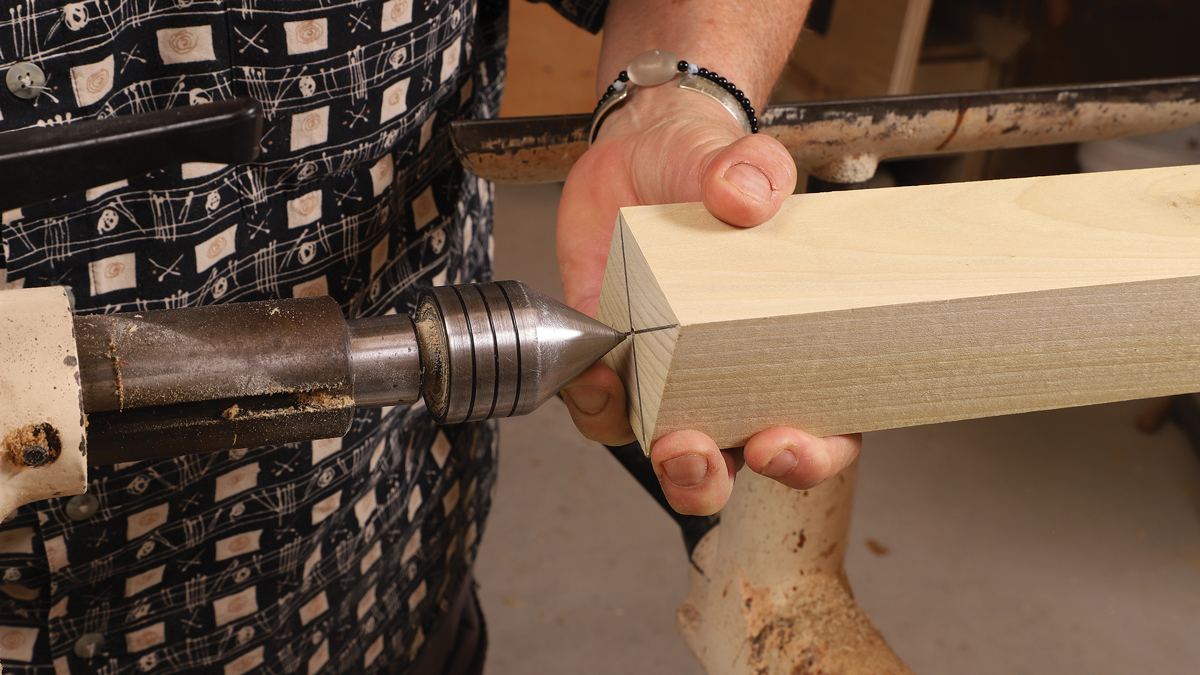 Live center. Ireland uses a free-spinning cone center in the lathe’s tailstock, tightening the workpiece by adjusting and locking the tailstock’s quill.