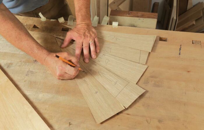 Mark mating edges. Eaton’s table ended up with 26 segments, all of which need to get glued together. To keep the parts in order, he labeled each edge. 