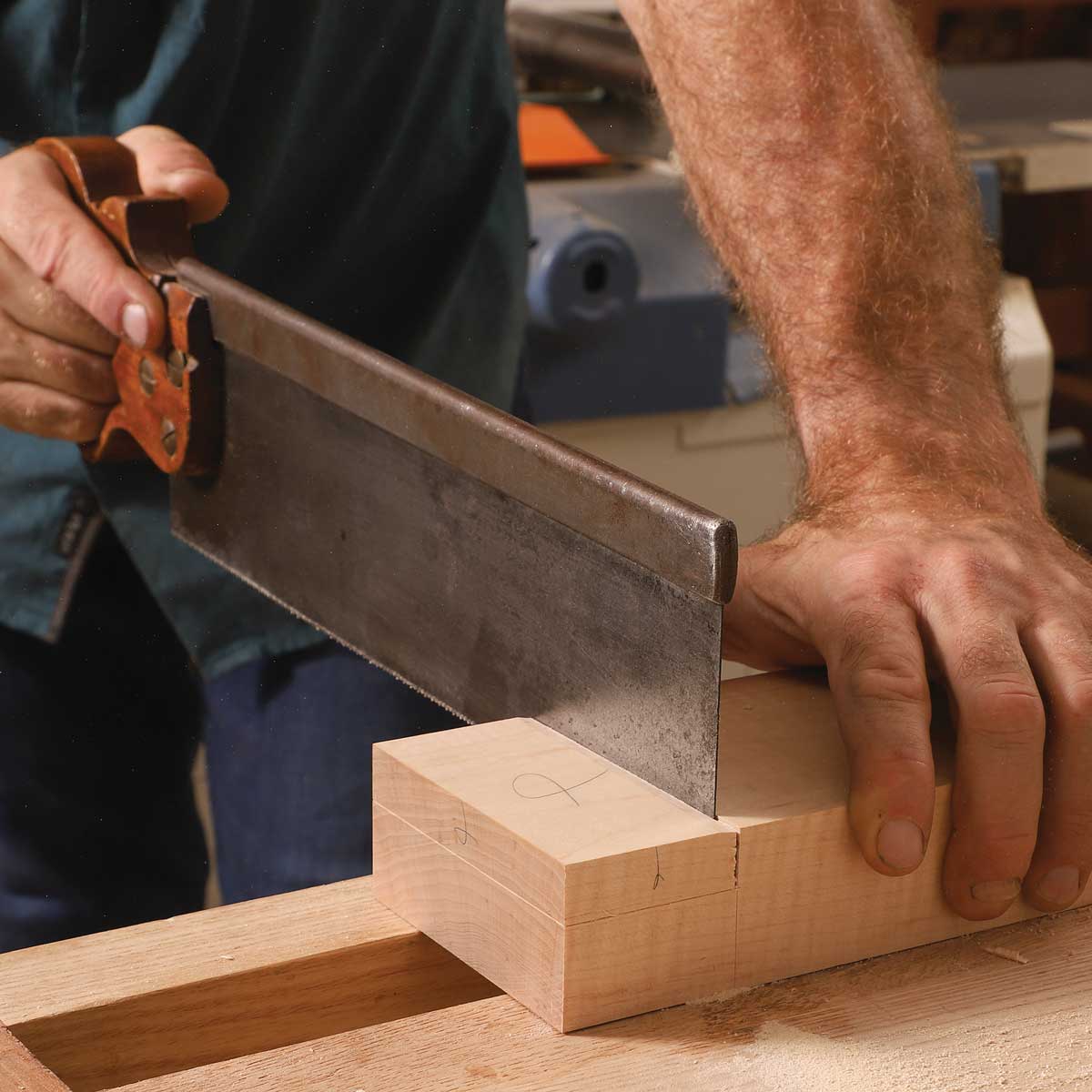 Saw the shoulder. After marking the rabbet’s depth line with a cutting gauge, cut down to it with a tenon saw.