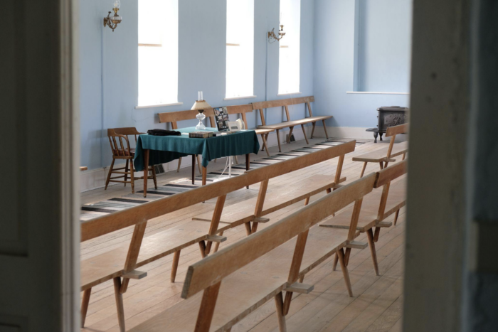 A room full of Amana Church Benches.