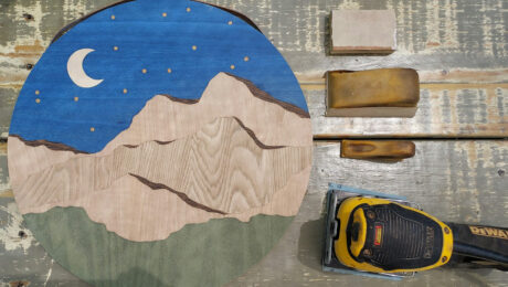 Veneer art featuring a mountain ridge in a night scene, by Chelsea Van Voorhis