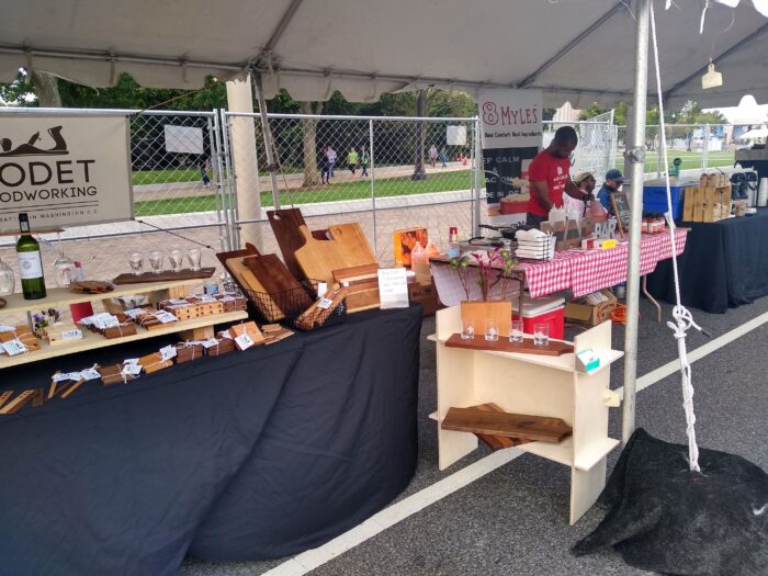 Godet Woodworking booth at a craft fair