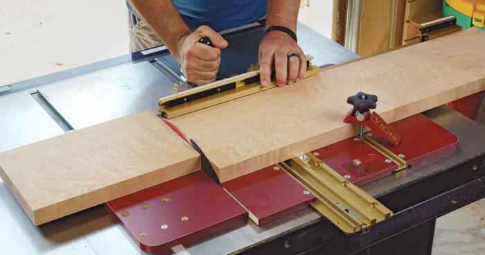 Smart features. Small cam screws (far left) hold your miter gauge securely on the sled, and an optional support bracket (near left) prevents large workpieces from flexing the fence.